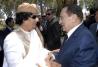 Libya's former leader Muammar Gaddafi (L) welcomes Egypt's former President Hosni Mubarak as he arrives to attend a meeting involving five Arab states in Tripoli June 28, 2010. REUTERS/Stringer